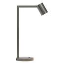 Stålfärgad bordslampa med justerbart huvud. Lampan har en enkel design med kantiga linjer/vinklar.