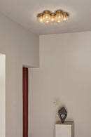 Liila 7 vägg- och taklampa, nordic gold / optic clear • NUURA